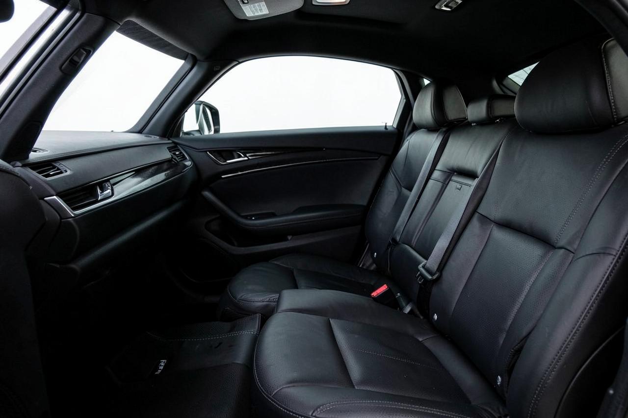 Clean black leather rear seats inside an executive sedan